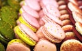 Small round cakes macaroons with a creamy filling. Colorful confetti with original flavors. A favorite delicacy all over the world Royalty Free Stock Photo