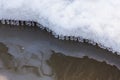 Small round icicles over water Royalty Free Stock Photo