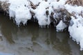 Small round icicles over water Royalty Free Stock Photo