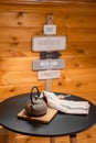 A small round table with an Asian teapot and towel in the cottage's wooden kitchen. Village life concept. Selective Royalty Free Stock Photo