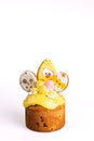 Small Easter Cake with Yellow Icing and Chick Decoration on White Background Royalty Free Stock Photo