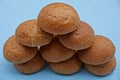 A roll of round wheat rolls on a table