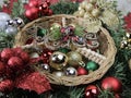 wicker peace basket, Christmas decorations (sparkly red, green, silver, gold balls) Royalty Free Stock Photo