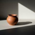 A small, rounded terracotta pot is Royalty Free Stock Photo