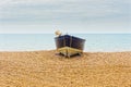 Small rowing boat beached on Bognor Regis beach Royalty Free Stock Photo