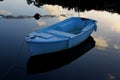 Small rowing boat on calm water