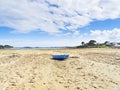 Small boat beached in Kermengi harbour at low tide Royalty Free Stock Photo