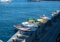 Small rowing boats tied to a dock area