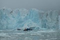 A small rubber boat in the arctic ocean Royalty Free Stock Photo