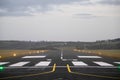 Small runway in a country airport and one engine airplane taking off. Aviation industry. Cloudy sky. Lights illuminated Royalty Free Stock Photo