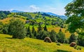 A small rural village with beautiful houses at the foot of the gentle green mountains Royalty Free Stock Photo