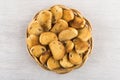 Small rusks with raisin in wicker basket on wooden table