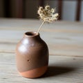 A small, rustic ceramic vase with Royalty Free Stock Photo