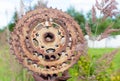 A small rusty metal wheel was put on an iron fence Royalty Free Stock Photo