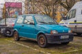 Small rusty old blue car Fiat Cinquecento parked Royalty Free Stock Photo