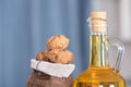 Small sacks filled with walnuts and a bottle of walnut oil