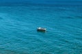 Small sailboat on a peaceful and serene blue waters of an ocean Royalty Free Stock Photo