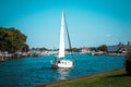 Small sailboat returning to harbor in South Haven Michigan