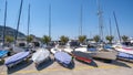 Small sailboats are docked on the port in the summer day Royalty Free Stock Photo