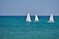 Small sailboats sailing in the calm waters of the Adriatic Sea,