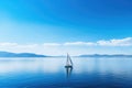 a small sailing boat on a calm blue sea