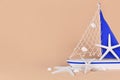 Small sailing boat decoration with starfish and seashells a