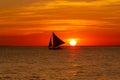 Small sailing boat at the sunset. Boracay, Philippines