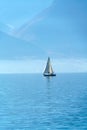 A small sailing yacht on the Lake Geneva and the Alps, Switzerland Royalty Free Stock Photo