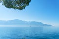 A small sailing yacht on the Lake Geneva and the Alps, Switzerland Royalty Free Stock Photo