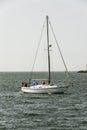 Small sailing yacht near the caostline