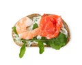 Small sandwich with shrimp, salmon and arugula isolated on white