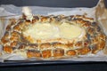 Small sausages in puff pastry and cheese showing the cheese