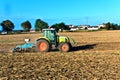 Small scale farming with tractor and plow Royalty Free Stock Photo