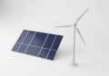 Small scale solar panel and wind turbine models on white background Royalty Free Stock Photo