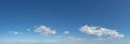 Small scattered silver clouds sweeping across city, panorama Royalty Free Stock Photo