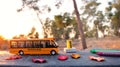 Small school bus on wooden table outdoors at autumn Royalty Free Stock Photo