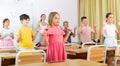 Small school kids doing physical exercises with teacher Royalty Free Stock Photo