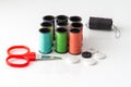Small Scissor and Sewing threads multicolored background closeup Royalty Free Stock Photo
