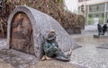 Small sculpture of bronze dwarf - sleeping guard Royalty Free Stock Photo