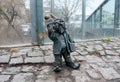 small sculpture of gnome or dwarf hold microphone next to Radio Bridge at Wroclaw