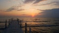 Small sea pier at sunset. Royalty Free Stock Photo