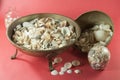 Small sea shells in glass jars and iron jars Royalty Free Stock Photo