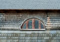 Small semi-circular mansard window of old building
