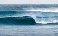 Small set of waves breaking on the beach forming a tube. Beautiful blue ocean water Royalty Free Stock Photo