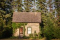 A small settlers house with creeping vines Royalty Free Stock Photo