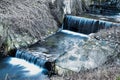Small shallow blue stream with two waterfalls Royalty Free Stock Photo
