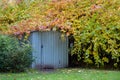 Gardening tools storage shed in the house backyard, autumn nature backgrounde Royalty Free Stock Photo