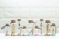 Small shells in many small glass bottles Royalty Free Stock Photo