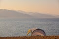 Small shelter on shores of mountain lake. Royalty Free Stock Photo