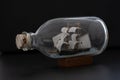Small ship model in a bottle with a cork stopper Royalty Free Stock Photo